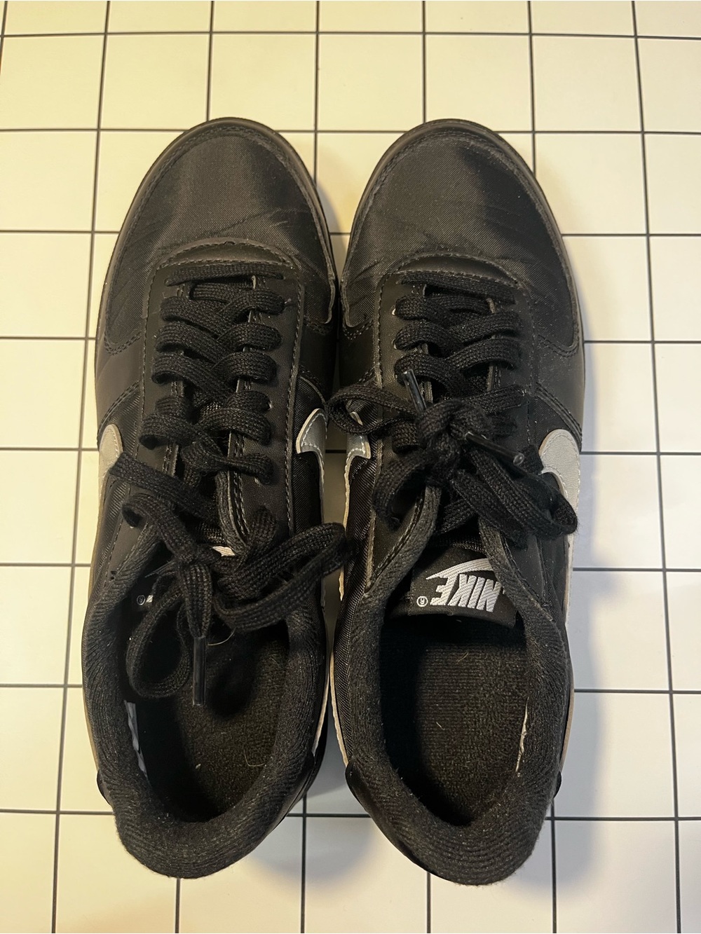 Nike Woman's Black Sneakers with White Swoosh